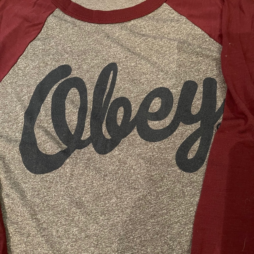 Obey baseball T with maroon sleeves. Size Medium